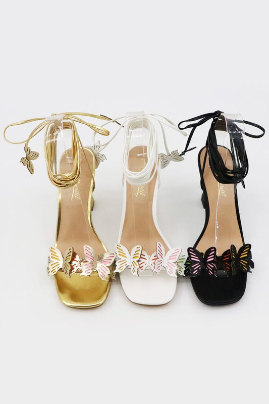 tacones altos con cordones y adornos de mariposas 